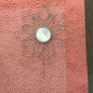 Metal necklace hanger with mirror.